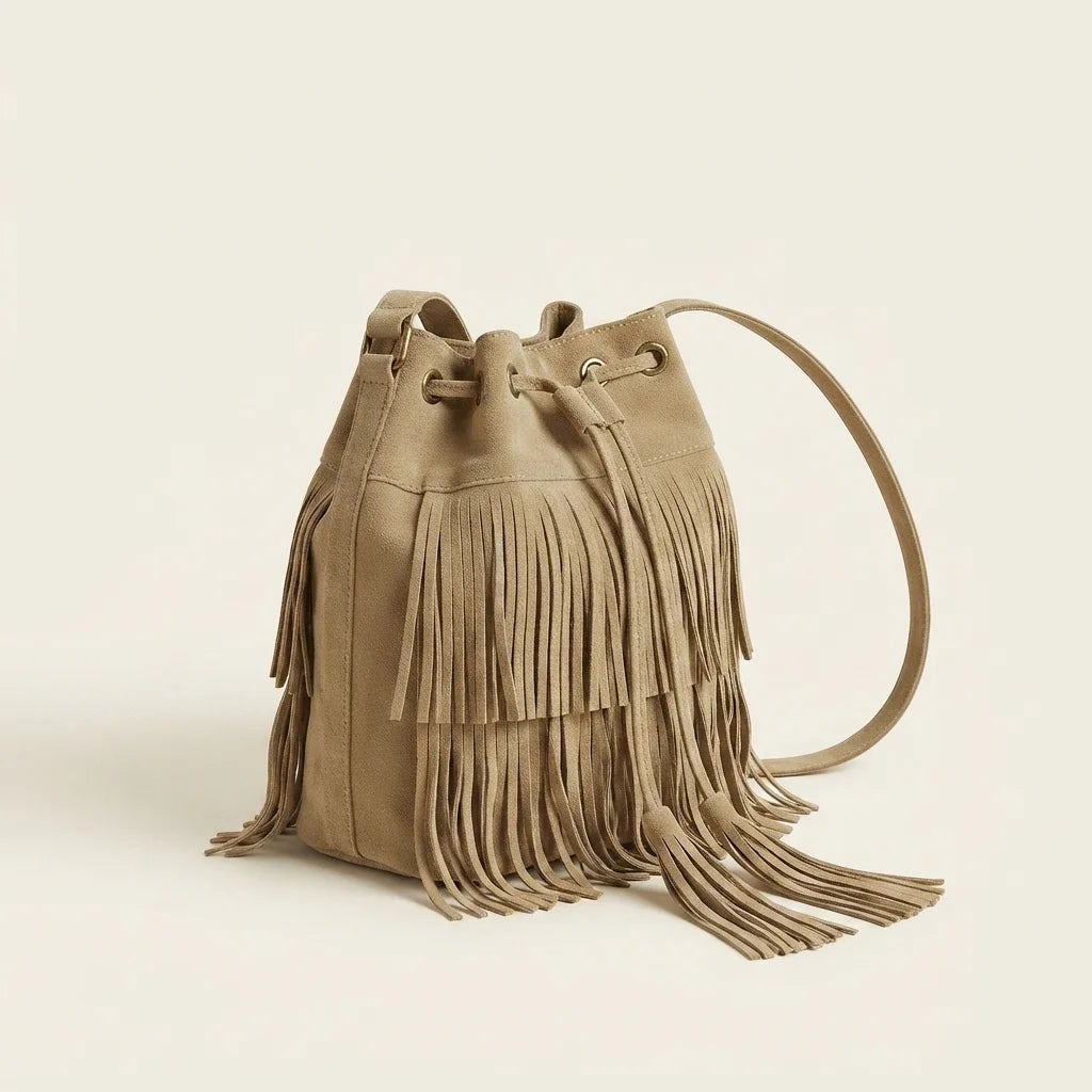 Khaki camel fringe bucket bag, three-quarter angle showing side depth