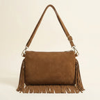 Back panel of Brown camel fringe crossbody bag with strap attachments