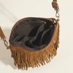 Interior lining and pockets of Brown camel fringe crossbody bag