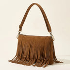 Brown camel fringe crossbody bag, three-quarter angle showing side depth