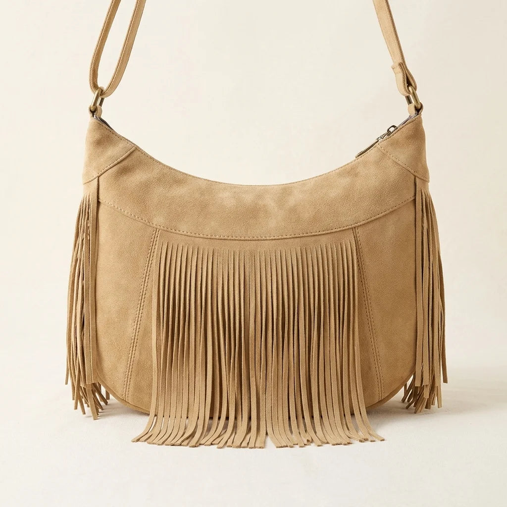 Back panel of Apricot camel fringe hobo bag with strap attachments