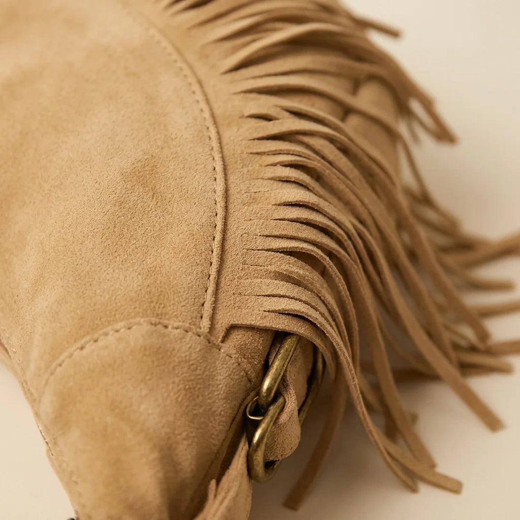 Close-up of fringe stitching and texture on Apricot camel fringe hobo bag