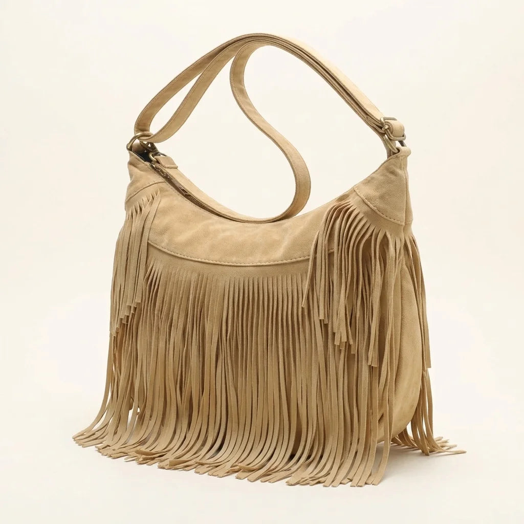 Apricot camel fringe hobo bag, three-quarter angle showing side depth