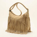 Apricot camel fringe hobo bag, three-quarter angle showing side depth