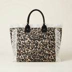 Back panel of Leopard canvas fringe tote bag with strap attachments