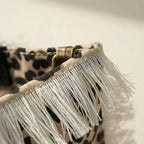 Close-up of fringe stitching and texture on Leopard canvas fringe tote bag