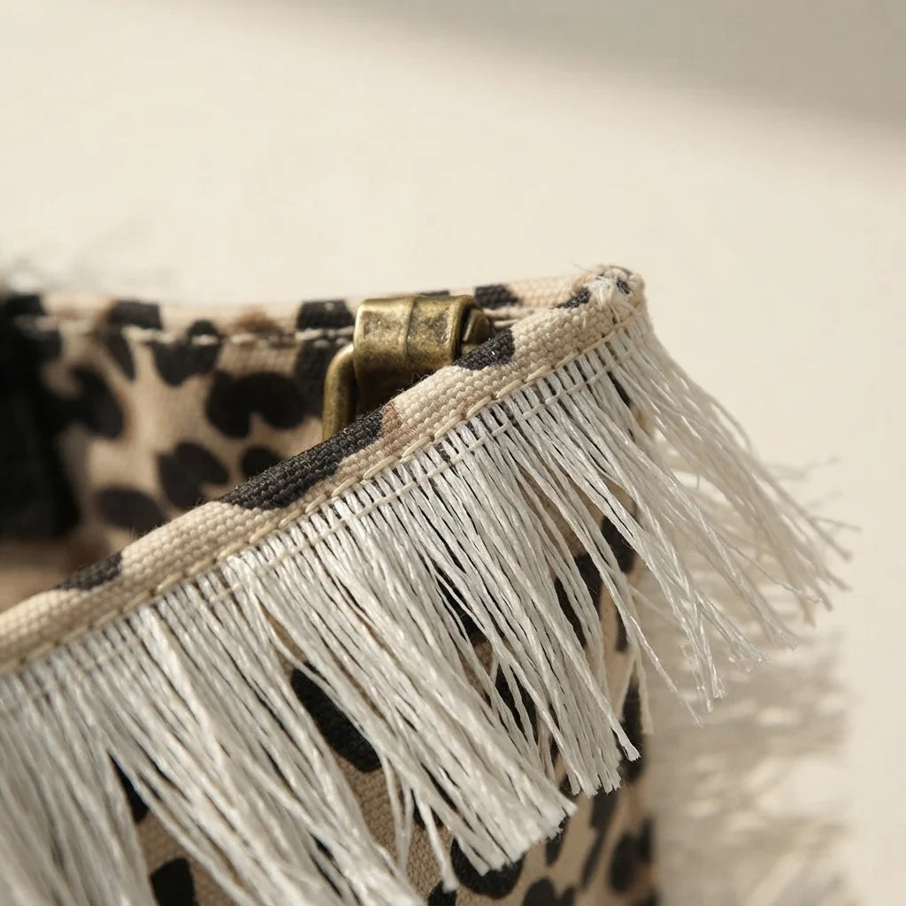 Close-up of fringe stitching and texture on Leopard canvas fringe tote bag