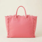 Back panel of Pink canvas fringe tote bag with strap attachments