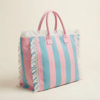 Pink & Blue canvas fringe tote bag, three-quarter angle showing side depth
