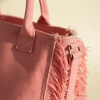 Close-up of fringe stitching and texture on Pink canvas fringe tote bag