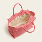 Interior lining and pockets of Pink canvas fringe tote bag