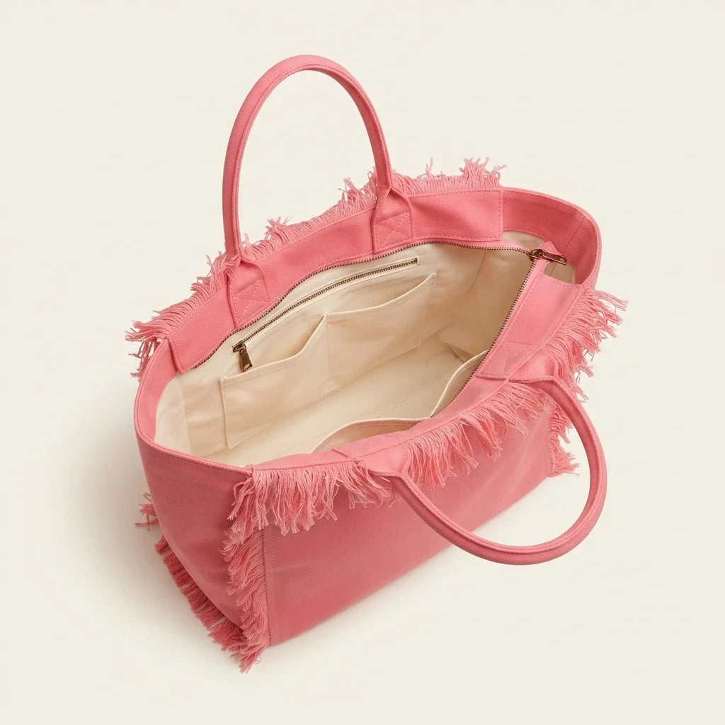 Interior lining and pockets of Pink canvas fringe tote bag