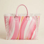 Back panel of Pink & White canvas fringe tote bag with strap attachments