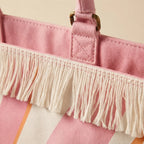 Close-up of fringe stitching and texture on Pink & White canvas fringe tote bag