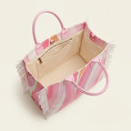 Interior lining and pockets of Pink & White canvas fringe tote bag
