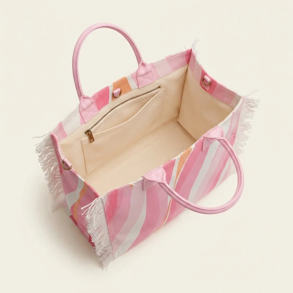 Interior lining and pockets of Pink & White canvas fringe tote bag