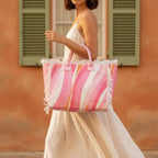 Woman wearing Pink & White canvas fringe tote bag with swaying fringe