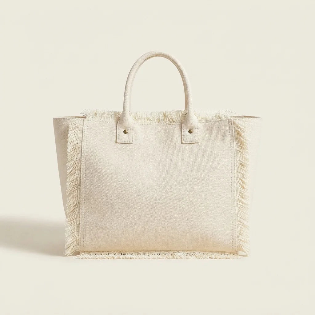 White canvas fringe tote bag, front view