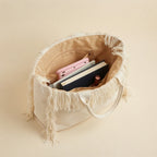 Interior lining and pockets of White canvas fringe tote bag