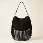 Back panel of Black cowhide bag with fringe with strap attachments