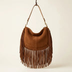 Back panel of Brown cowhide bag with fringe with strap attachments
