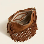 Interior lining and pockets of Brown cowhide bag with fringe