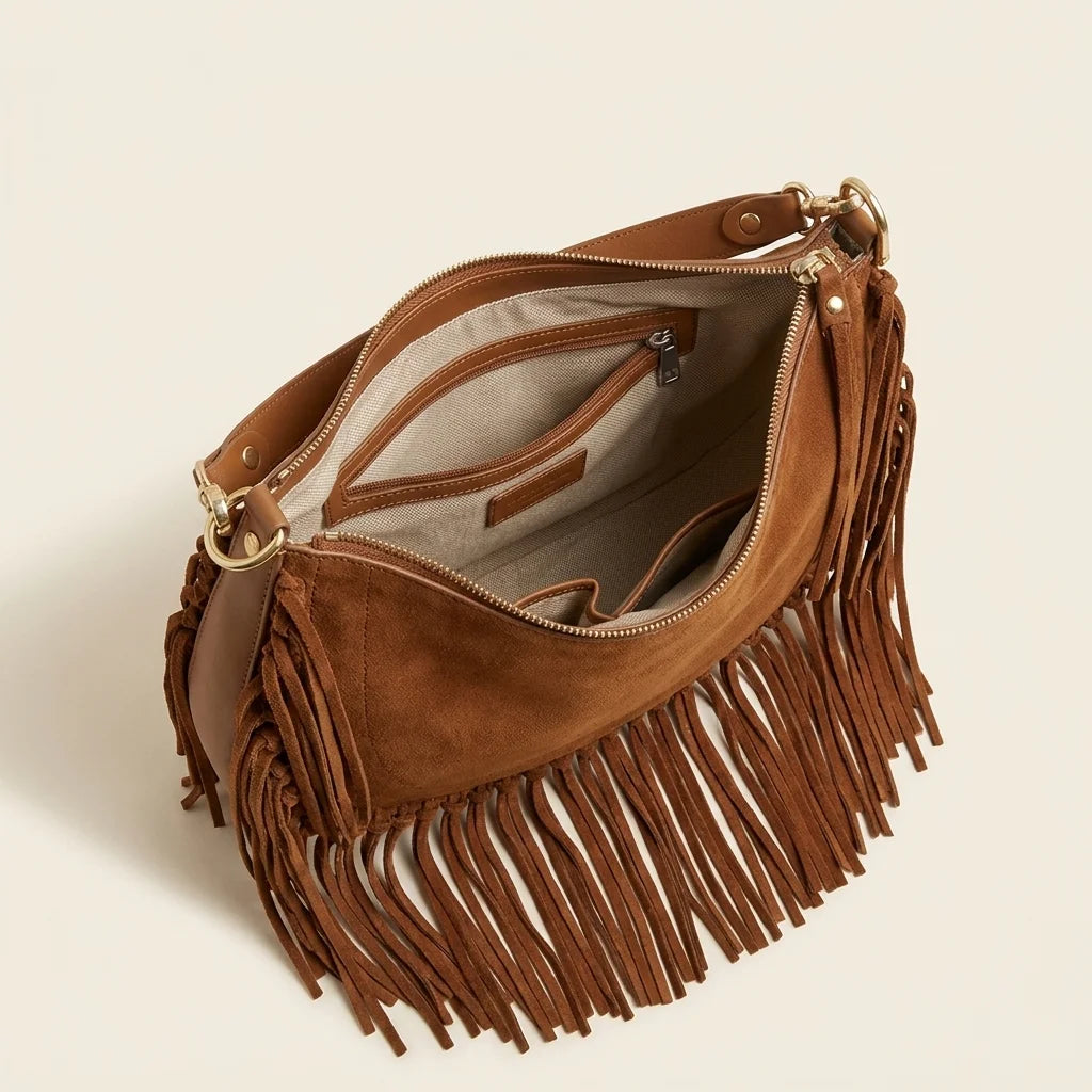 Interior lining and pockets of Brown cowhide bag with fringe