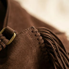 Close-up of fringe stitching and texture on Coffee cowhide bag with fringe