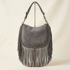 Back panel of Grey cowhide bag with fringe with strap attachments