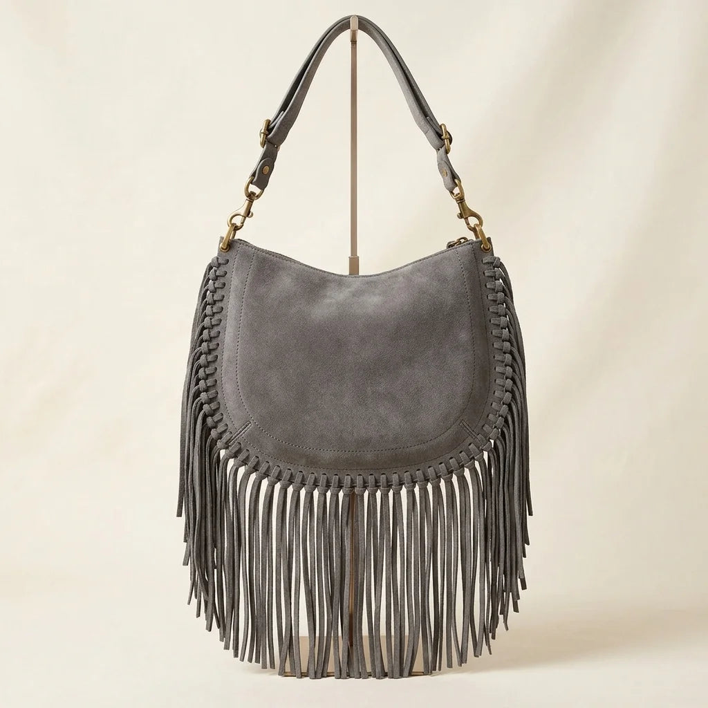 Back panel of Grey cowhide bag with fringe with strap attachments