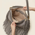 Interior lining and pockets of Grey cowhide bag with fringe