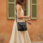 Woman wearing Black cowhide crossbody bag with fringe with swaying fringe