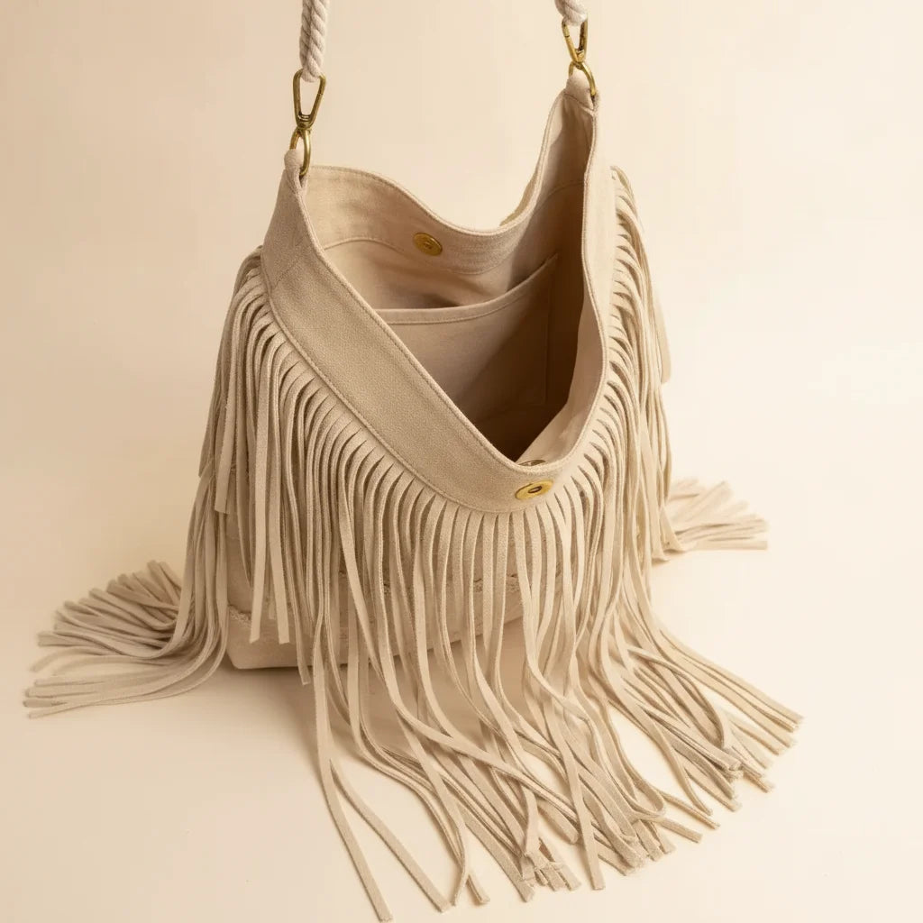 Interior lining and pockets of Cream cream fringe bag