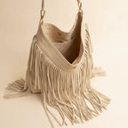 Interior lining and pockets of Cream cream fringe bag