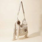 Cream cream fringe bag, three-quarter angle showing side depth