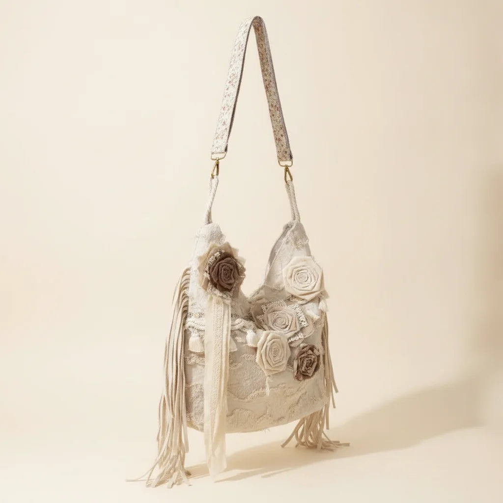 Cream cream fringe bag, three-quarter angle showing side depth