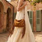 Woman wearing Brown dark brown fringe bag with swaying fringe