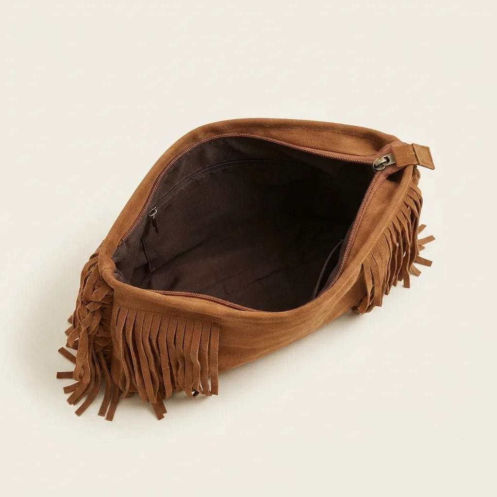 Interior lining and pockets of camel suede fringe crossbody bag