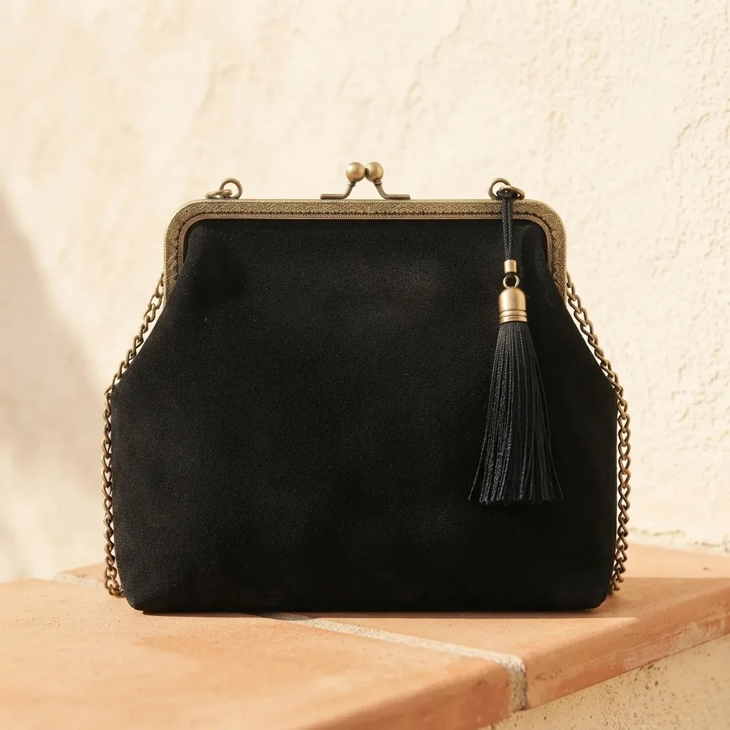 Back panel of Black designer black fringe bag with strap attachments