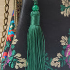 Close-up of fringe stitching and texture on Floral designer boho fringe bag