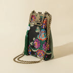Floral designer boho fringe bag, three-quarter angle showing side depth