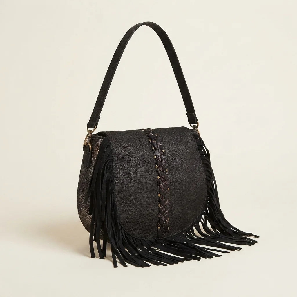 Black designer fringe crossbody bag, three-quarter angle showing side depth