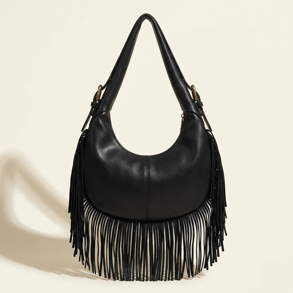 Back panel of Black faux leather fringe hobo bag with strap attachments