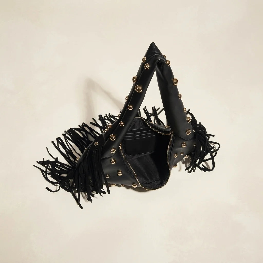 Interior lining and pockets of Black faux leather fringe hobo bag