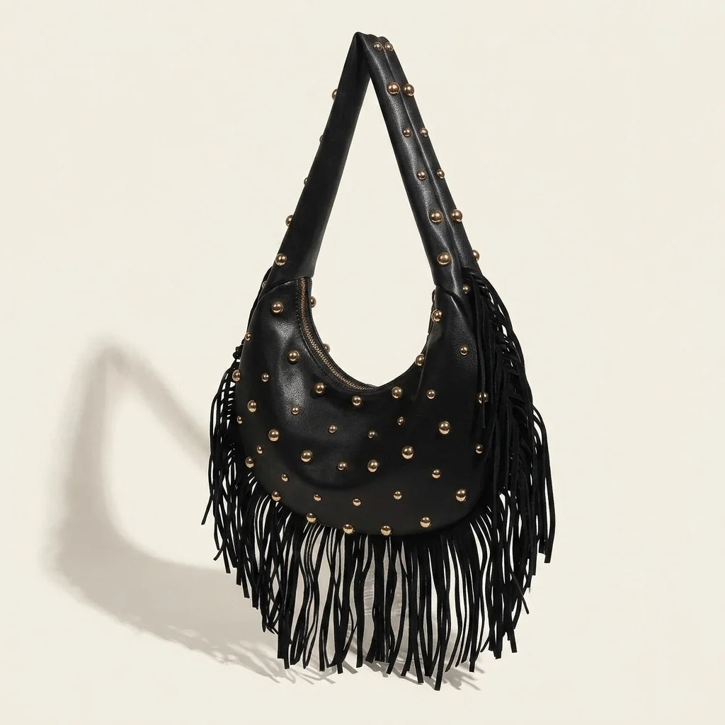 Black faux leather fringe hobo bag, three-quarter angle showing side depth