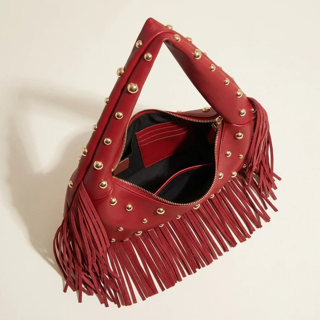 Interior lining and pockets of Wine Red faux leather fringe hobo bag