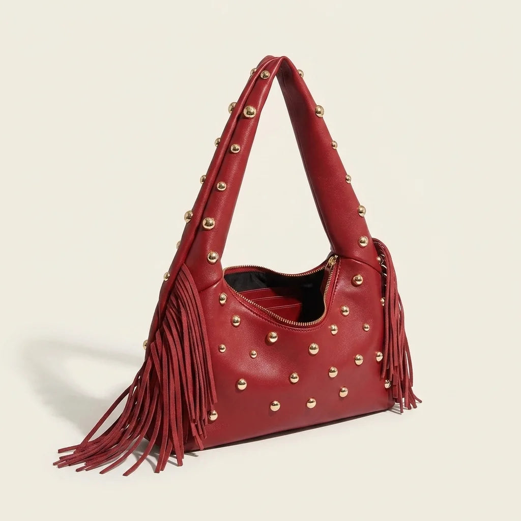 Wine Red faux leather fringe hobo bag, three-quarter angle showing side depth