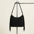Back panel of Black faux suede fringe bag with strap attachments