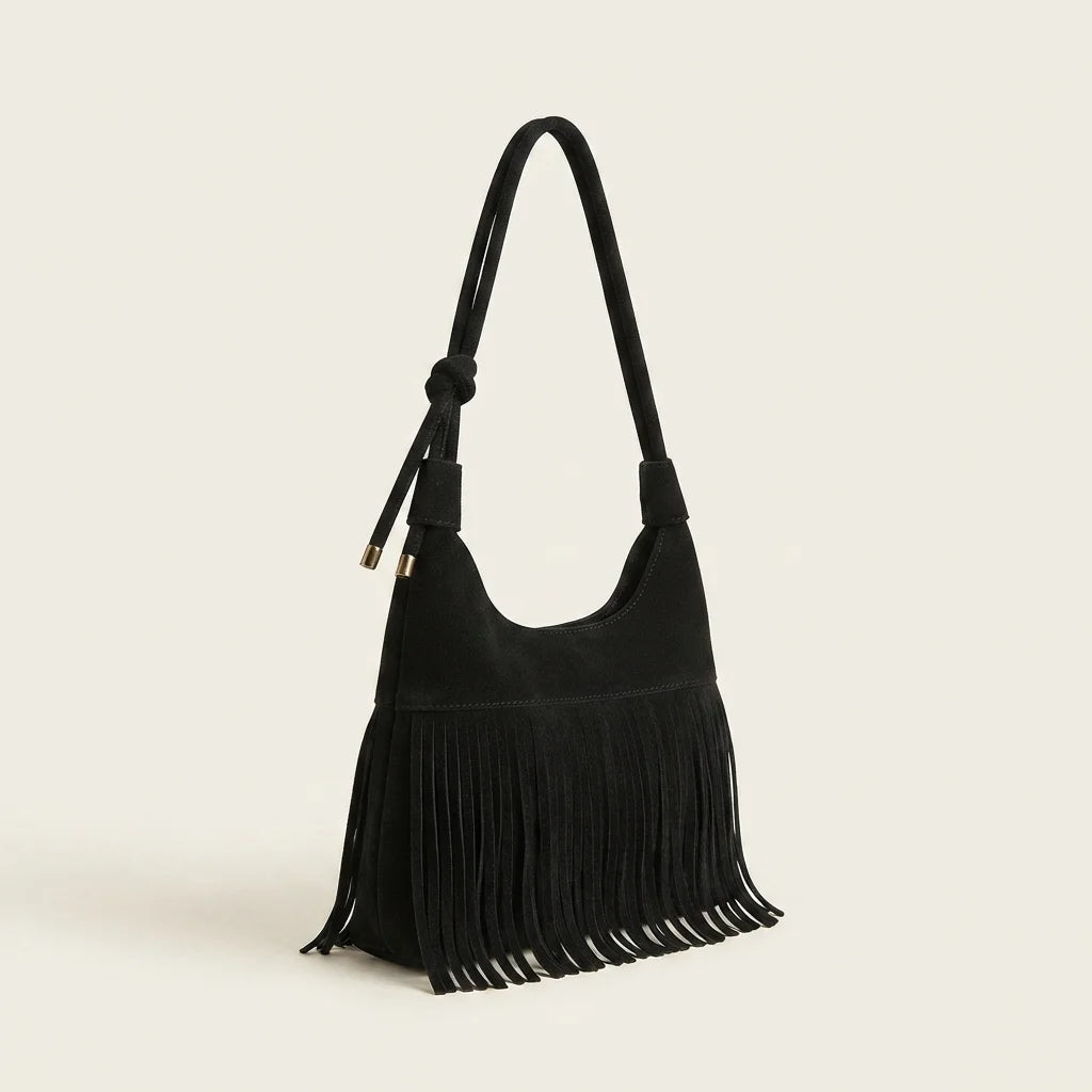 Black faux suede fringe bag, three-quarter angle showing side depth