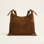Back panel of Brown faux suede fringe bag with strap attachments